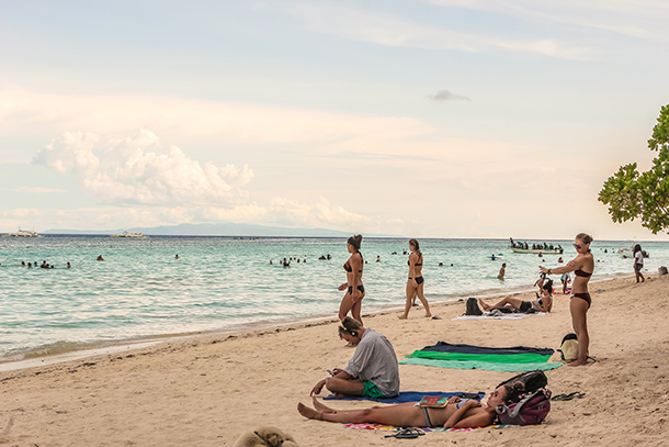 Dumaluan Beach Resort: Sun Tanning and Reading a Book