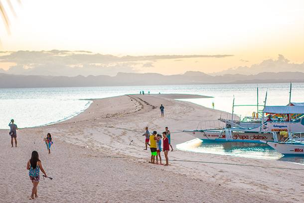 Why I Travelled Without my Daughter: Greeting the Sunrise at the sandbar in Kalanggaman Island